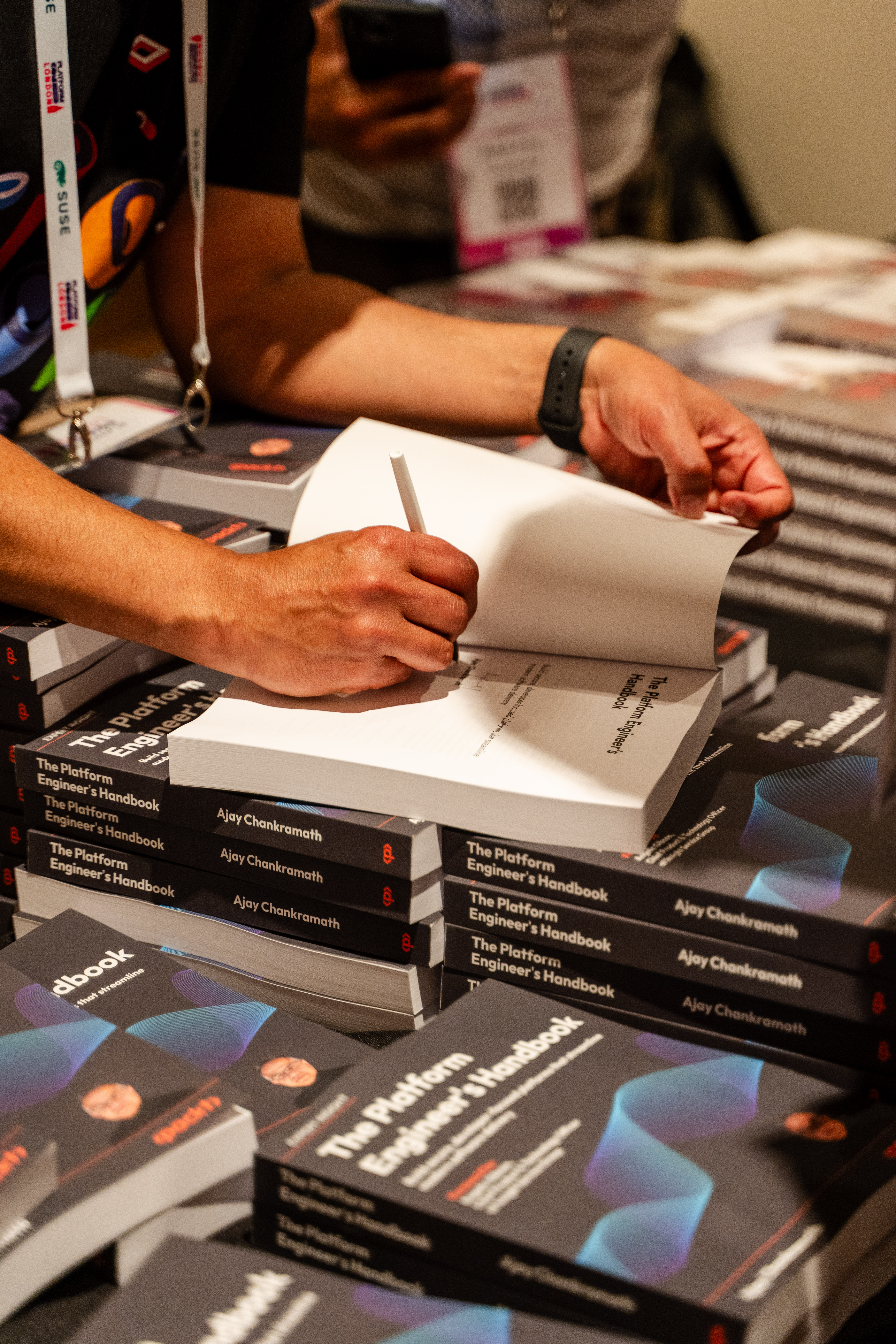 Signing copies of The Platform Engineer's Handbook and Effective Platform Engineering